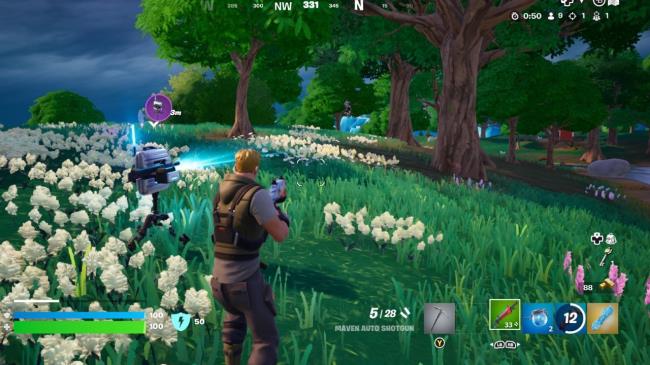 A Business Turret firing at an enemy in a grass field.