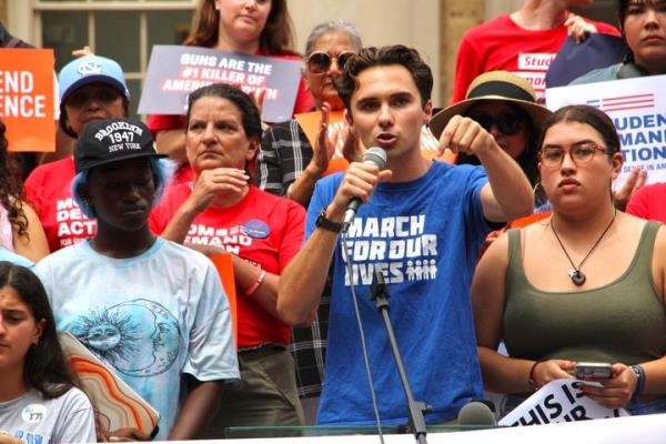 March For Our Lives co-founder David Hogg speaks at a gun safety rally in Chapel Hill, North Carolina on Wednesday. He hugged teary eyed students, several who he had met previously, and urged them to take their pain and anger to the ballot box.
